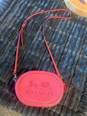 Coach Pink Leather Oval Crossbody Bag with Embossed Horse & Carriage/camera bag.